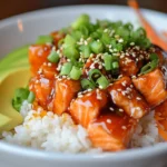 Hot Honey Salmon Bowl served in a bowl with rice & veggies